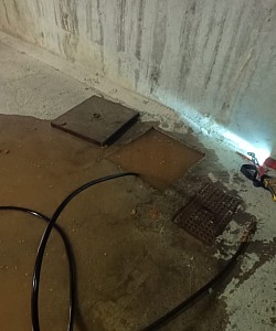 Débordement d'un regard dans un garage commun